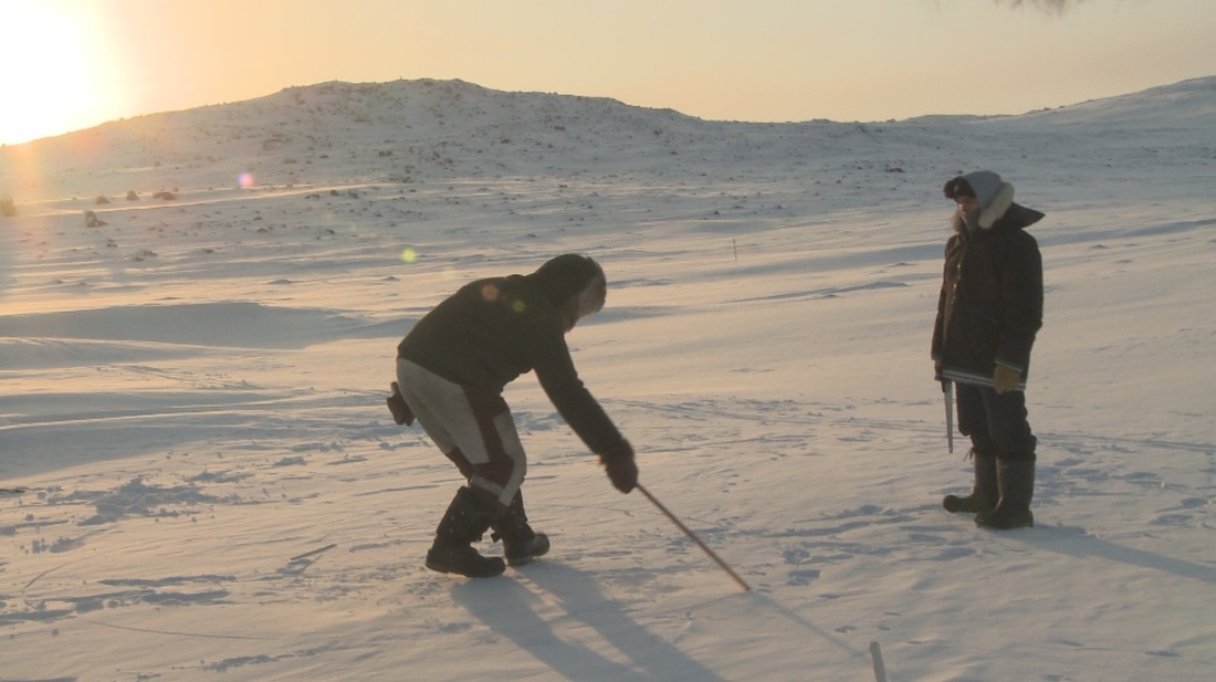 Johnny Issaluk, a world champion in Arctic high kick, is preparing to make an igloo. ©2013 Sivummut